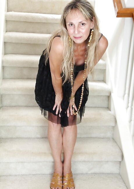 Sexy mature Sophie in sexy skirt reveals small tits and spreads her legs 