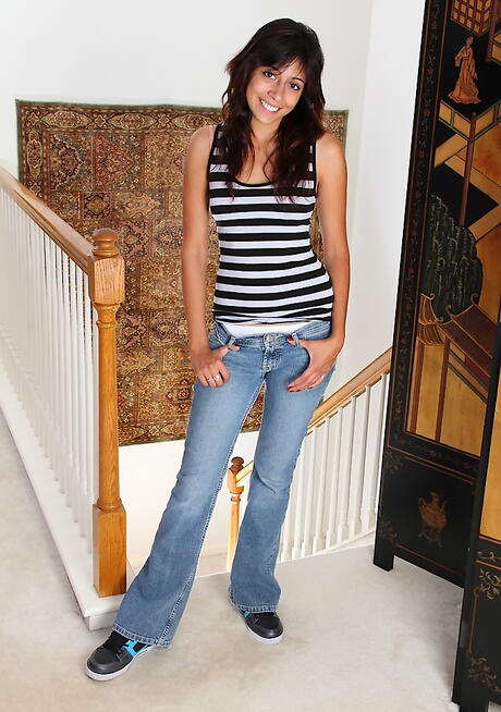 Hot teen Rocky exposes small tits and shaved pussy 